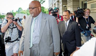 Howard L. Brooks (right), an aide to D.C. Mayor Vincent C. Gray, makes his way to a waiting car after pleading guilty Thursday in federal court to lying about furtive campaign payments to candidate Sulaimon Brown before the 2010 Democratic primary for mayor. (Rod Lamkey Jr./The Washington Times)