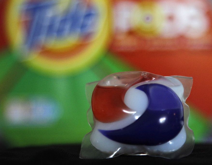 Laundry detergent makers introduced miniature packets in recent months such as this one photographed May 24, 2012, in Houston. But doctors across the country say children are confusing the tiny, brightly colored packets with candy and swallowing them. Nearly 250 cases have been reported to poison control centers. (Associated Press)