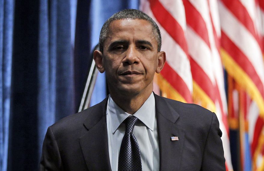 **FILE** President Obama walks offstage May 23, 2012, to greet supporters after speaking at a campaign fundraiser in Denver. (Associated Press)