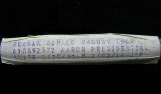 This undated image released by PFCAuctions shows a vial containing President Ronald Reagan&#39;s dried blood residue. A Channel Islands online auction house has angered the Reagan Foundation by claiming to offer a vial that once contained his blood. The auctioneers say it was used by the laboratory that tested Reagan&#39;s blood when he was hospitalized after a 1981 assassination attempt in Washington. (AP Photo/PFCAuctions)