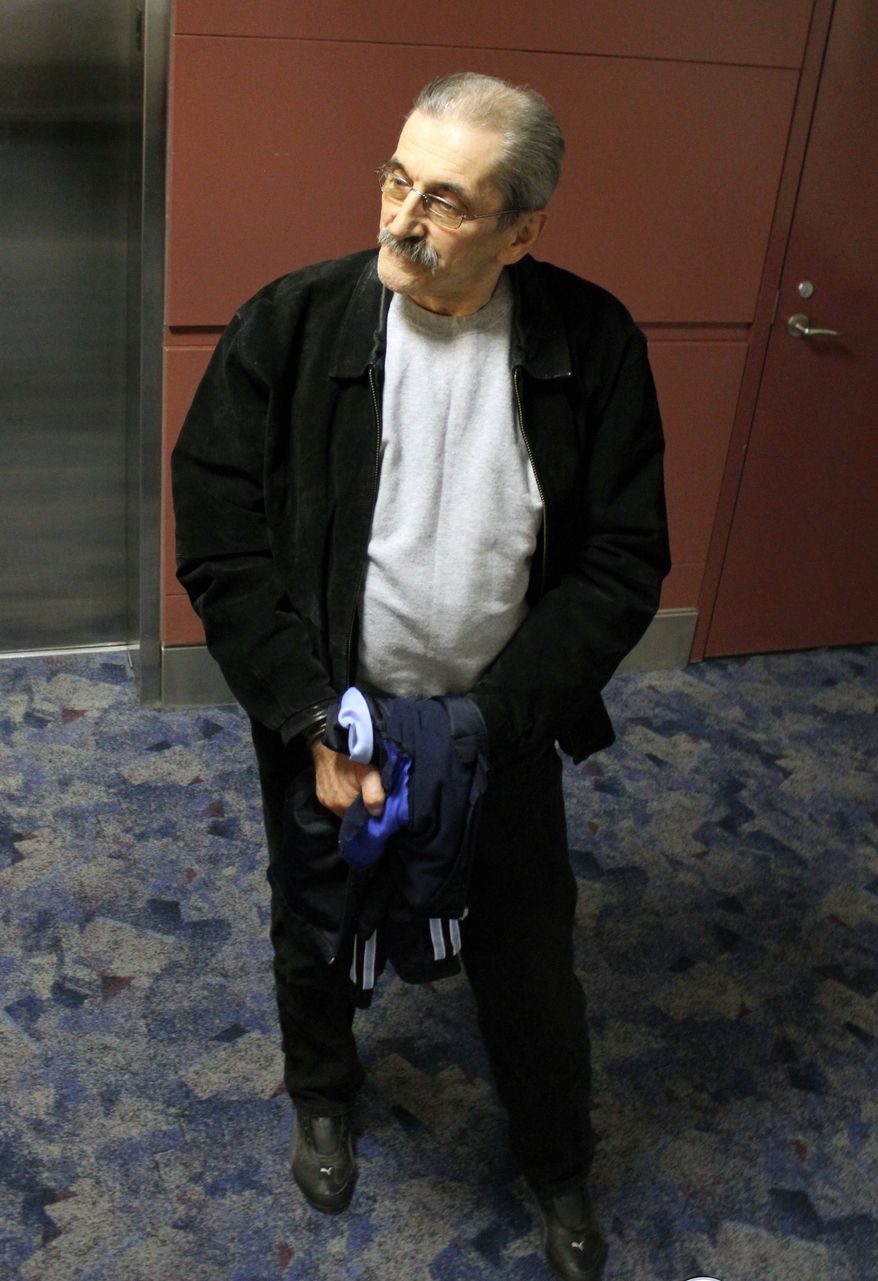 Dejan Radojkovic, a former Bosnian-Serb police commander tied to Srebrenica genocide, arrives at McCarran Airport in Las Vegas for the initial leg of his removal flight back to Sarajevo. The former Bosnian Serb police commander accused of playing a leading role in the 1995 massacre of Bosnian Muslims in Srebrenica has been deported to his native country, U.S. officials said on May 24, 2012. (Associated Press/U.S. Immigration and Customs Enforcement)