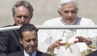 ** FILE ** Pope Benedict XVI, accompanied by his private secretary, Monsignor Georg Gaenswein (top left), and his butler, Paolo Gabriele, arrives in St. Peter&#39;s Square at the Vatican for a general audience on Wednesday, May 23, 2012.  (AP Photo/Andrew Medichini)