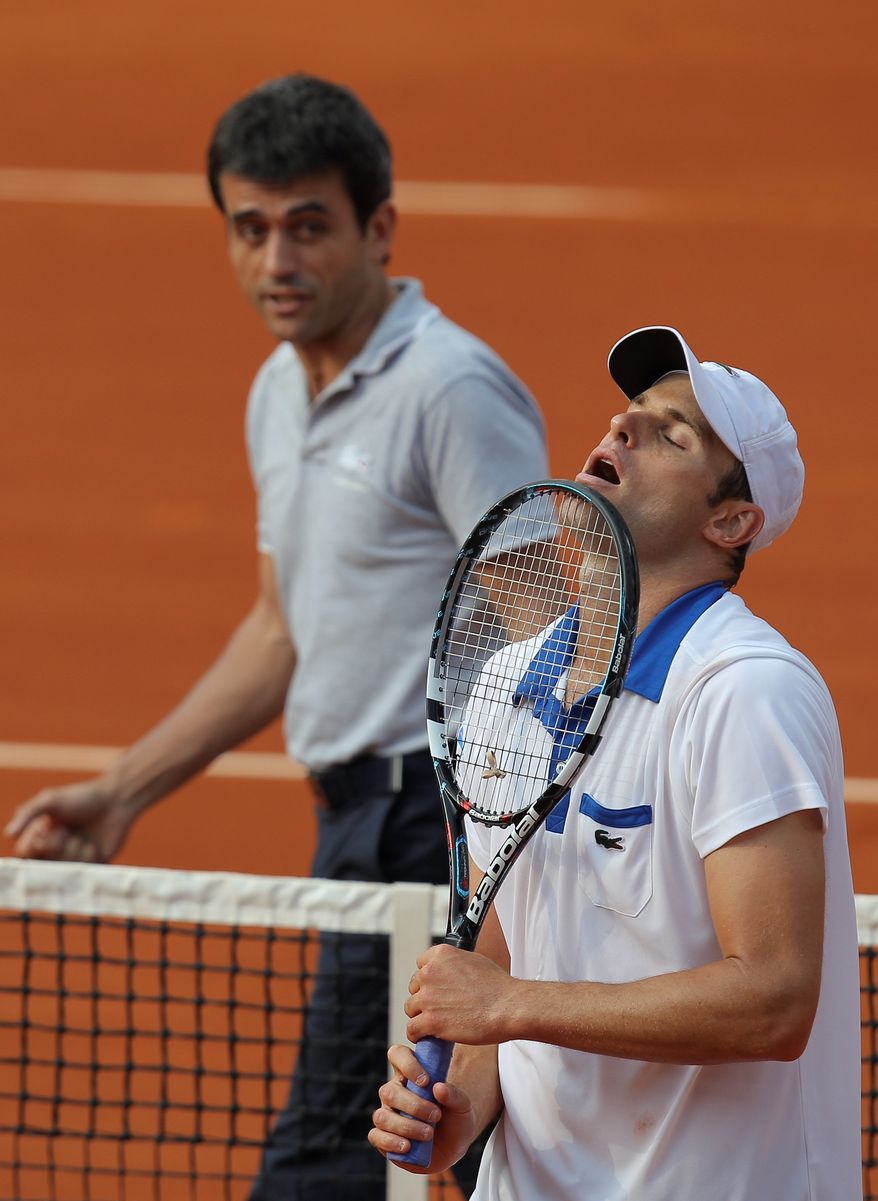Andy Roddick's loss to 88th-ranked Nicolas Mahut dropped him to 7-10 this season, 0-4 on clay. He exited a Grand Slam tournament in the first round for the first time since 2007. (Associated Press)
