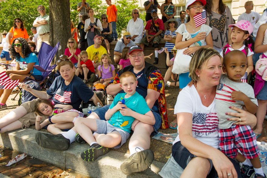 Crowds gather to watch the Memorial Day Parade along Constitution Avenue. (Andrew Harnik/The Washington Times)