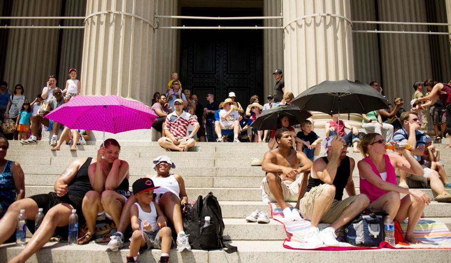 Crowds gather on the steps of the National Archives to watch the Memorial Day Parade on Constitution Avenue. (Andrew Harnik/The Washington Times) ** FILE **