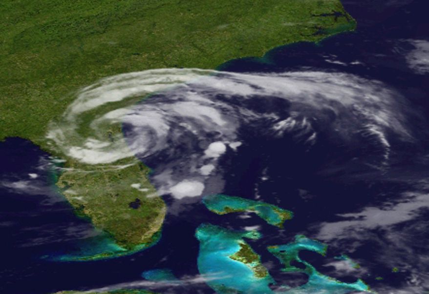 This image provided by the National Oceanic and Geographic Authority shows a satellite image of Tropical Storm Beryl as it makes landfall in Florida early Sunday, May 28, 2011. The storm made landfall in northeastern Florida, bringing drenching rains and driving winds to the southeastern U.S. coast, forecasters said. (AP Photo/NOAA)