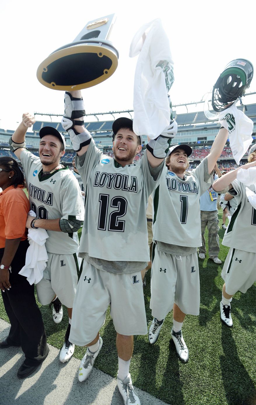 Loyola players (from left) T.J. Harris, Eric Lusby and Michael Bonitatibus celebrated the school's first lacrosse championship after beating Maryland 9-3 on Monday. Lusby, who scored a tournament-record 17 goals, won't be back next season.