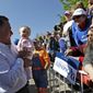 Republican presidential candidate and former Massachusetts Gov. Mitt Romney holds a baby May 29, 2012, while greeting supporters after a campaign event in Craig, Colo. (Associated Press)