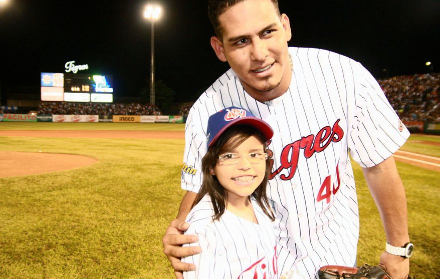 Vicky Cabrera and Nationals catcher Wilson Ramos after Vicky threw out the first pitch for the Tigres de Aragua. (Provided by Marfa Mata)