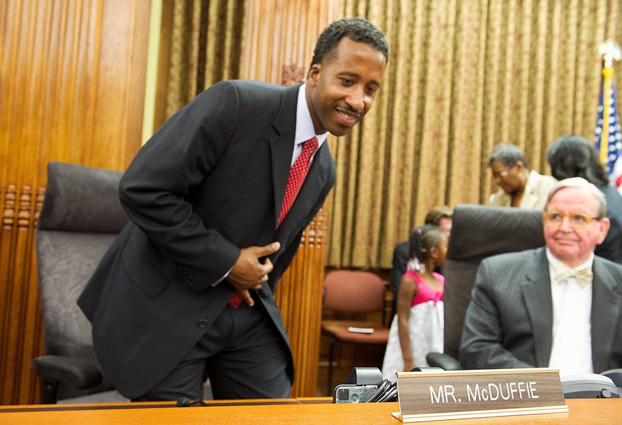 Kenyan McDuffie, the newly elected D.C. councilman in Ward 5, tries out his new seat on the dais in the council chamber room at the Wilson Building in Washington, D.C. after being sworn in on Wednesday, May 30, 2012. McDuffie was elected May 15 in a special election to replace Councilman Harry Thomas, who plead guilty to funneling some $350,000 in funds intended for city children. (Barbara L. Salisbury/The Washington Times)