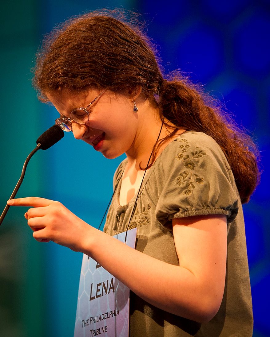 Lena Greenberg, 14, of Philadelphia, Pa., works on spelling her word during the preliminary rounds of the 2012 Scripps National Spelling Bee at the Gaylord National Resort and Convention Center in National Harbor, Md., Wednesday, May 30, 2012. This year, 278 spellers from around the United States and all walks of life will compete for the title of 2012 Scripps National Spelling Bee champion. Lena spelled her word, jong, correctly. (Rod Lamkey Jr/The Washington Times)