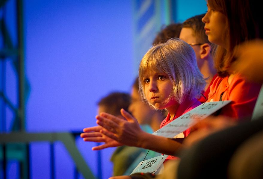 Six year-old Lori Anne C. Madison of Woodbridge, Va., waits in her seat for her chance to spell her word during the preliminary rounds of the 2012 Scripps National Spelling Bee at the Gaylord National Resort and Convention Center in National Harbor, Md., Wednesday, May 30, 2012. This year, 278 spellers from around the United States and all walks of life will compete for the title of 2012 Scripps National Spelling Bee champion. Lori Anne spelled her word, dirigible, correctly. (Rod Lamkey Jr/The Washington Times)