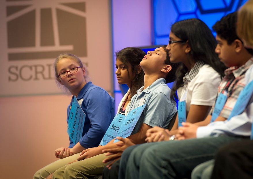 Jack Maglalang,12, of Orangevale, Calif., (third from left) reacts to misspelling his word during the third round of the 2012 Scripps National Spelling Bee at the Gaylord National Resort and Convention Center in National Harbor, Md., Wednesday, May 30, 2012. This year, 278 spellers from around the United States and all walks of life will compete for the title of 2012 Scripps National Spelling Bee champion. (Rod Lamkey Jr/The Washington Times)