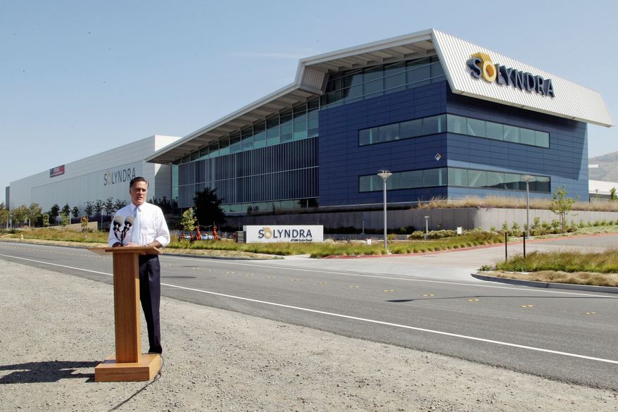 Mitt Romney campaigns at the shuttered Solyndra plant in Fremont, Calif., on Thursday. "It's a symbol not of success, but of failure," he said of the company lauded by President Obama that received $535 million in government-backed loan guarantees. (Associated Press)