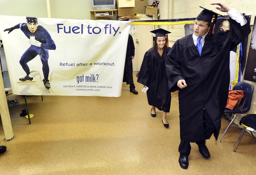 **FILE** Horizon High School seniors Daniel Odom and Sydney Priest leave the gym May 23, 2012, before their graduation in Decatur, Ala. (Associated Press/The Decatur Daily)
