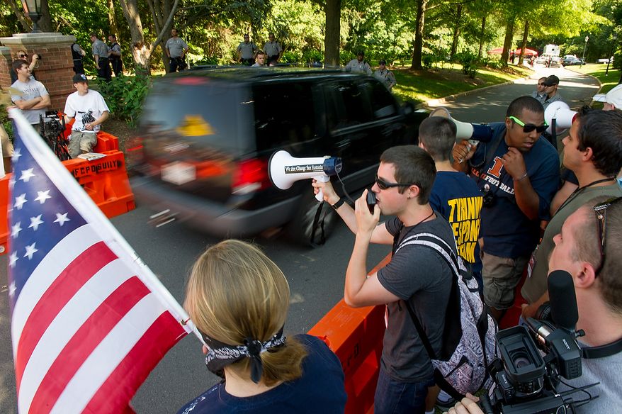 Protesters demonstrate at the entrance to the Marriott Westfields where the annual Bilderberg Conference is being held, Chantilly, Va., Thursday, May 31, 2012. The Bilderberg Conference is an annual meeting of highly influential people in private industry and public office from North America and Western Europe. (Andrew Harnik/The Washington Times)