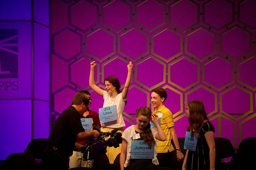 Lana Greenberg, 14, of Philadelphia, Pa., (left) celebrates with the other championship round finalists during the semifinals of the 2012 Scripps National Spelling Bee at the Gaylord National Resort and Convention Center in Oxon Hill, Md., Thursday, May 31, 2012. (Rod Lamkey Jr/The Washington Times)