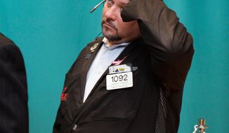 Trader Jason Harper works June 1, 2012, on the floor of the New York Stock Exchange. (Associated Press)
