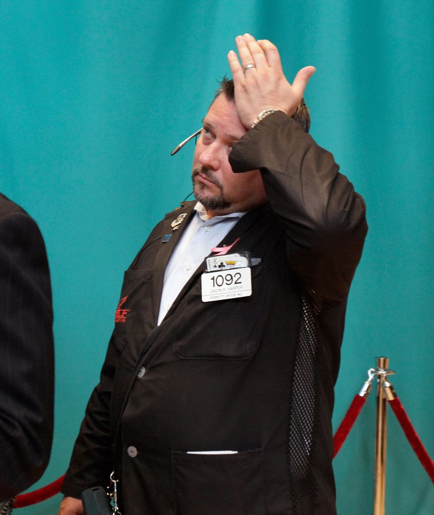 Trader Jason Harper works June 1, 2012, on the floor of the New York Stock Exchange. (Associated Press)