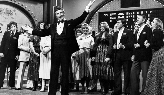 Richard Dawson (foreground) hosts the TV game show &quot;Family Feud&quot; in May 1978 as the casts of ABC comedy series &quot;Eight Is Enough,&quot; &quot;The Love Boat,&quot; &quot;Soap&quot; and &quot;Three&#39;s Company&quot; compete to benefit charity. (Associated Press)