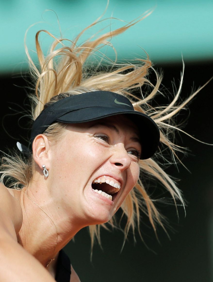 Russia's Maria Sharapova serves the ball to China's Peng Shuai during their third round match in the French Open tennis tournament at the Roland Garros stadium in Paris, Saturday, June 2, 2012. Sharapova won 6-2, 6-1. (AP Photo/Christophe Ena)