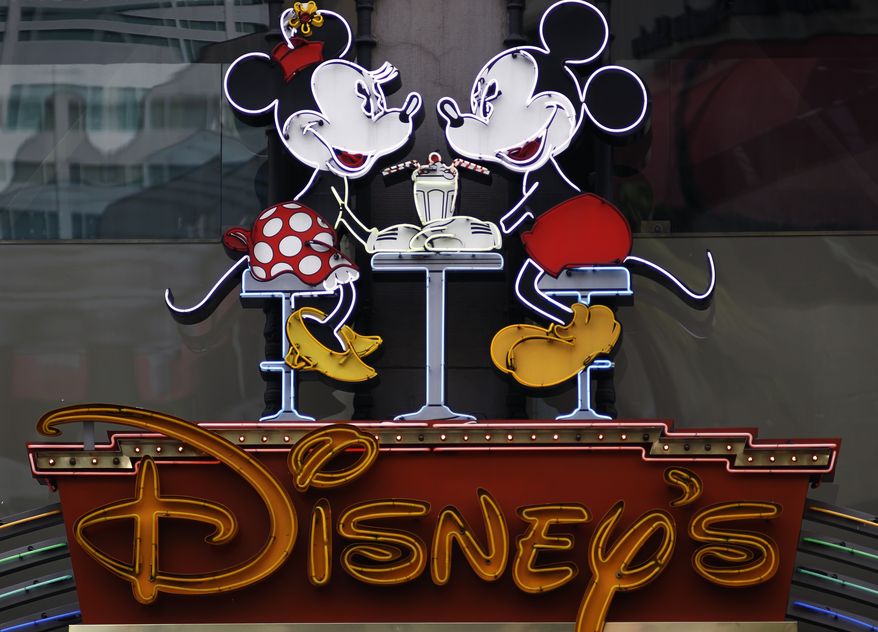 ** FILE ** In this Feb. 6, 2012 photo, the Disney Soda Fountain & Studio Store marquee is seen on Hollywood Boulevard in Los Angeles. The Walt Disney Co. said Tuesday, June 5, 2012, its programming will no longer be sponsored by junk food, becoming the first major media company to ban such ads for its TV channels, radio stations and websites intended for children. (AP Photo/Damian Dovarganes)