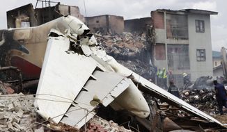 Debris from an MD-83 aircraft that crashed while approaching the airport in Lagos, Nigeria, on Sunday, June 3, 2012, is pictured on Monday. (AP Photo/Sunday Alamba)