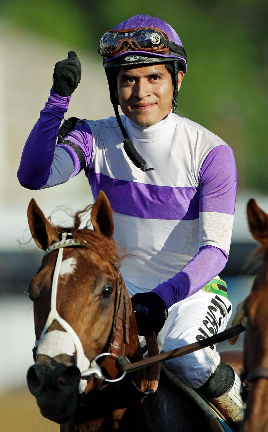 Jockey Mario Gutierrez, 25, hasn't looked back since owner Paul Reddam and trainer Doug O'Neill put him on I'll Have Another before the Robert B. Lewis Stakes at Santa Anita in February. Victories in the Kentucky Derby and Preakness Stakes followed, and now Gutierrez is on the brink of Triple Crown history. (Associated Press)
