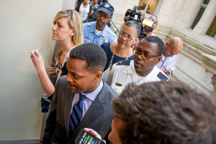 D.C. Council Chairman Kwame Brown leaves his office at the Wilson Building. (Andrew Harnik/The Washington Times)