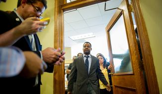 D.C. Council Chairman Kwame Brown leaves his office at the Wilson Building. (Andrew Harnik/The Washington Times)