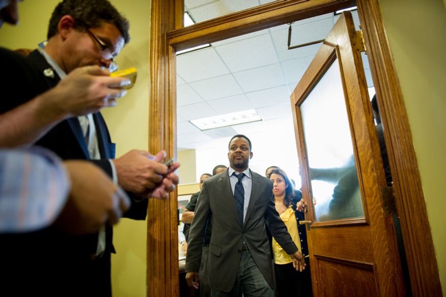 D.C. Council Chairman Kwame Brown leaves his office at the Wilson Building. (Andrew Harnik/The Washington Times)