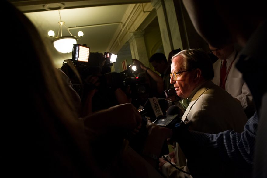 D.C. Councilmember Jim Graham (D-Ward 1) speaks to the media before having a closed door discussion with the council. (Andrew Harnik/The Washington Times)
