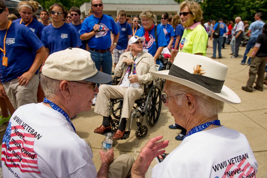 Veterans visit the World War II memorial on the 68th anniversary of D-Day as part of the Honor Flights program which flies U.S. veterans to Washington, D.C. to visit memorials on the National Mall, Washington, D.C., Wednesday, June 6, 2012. (Andrew Harnik/The Washington Times)
