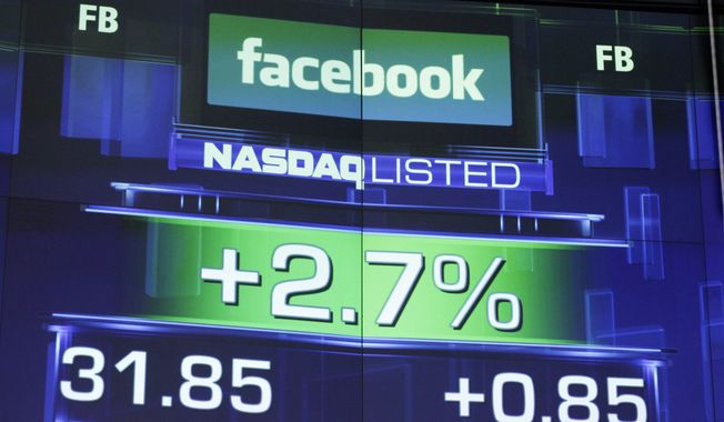 **FILE** The pre-market price for Facebook is seen May 23, 2012, at the Nasdaq MarketSite in New York. (Associated Press)
