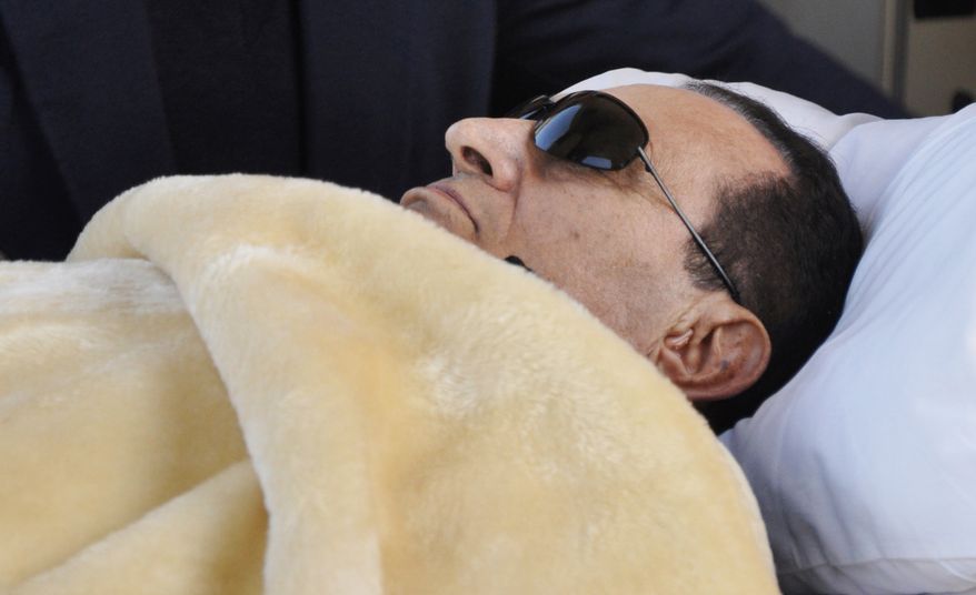 **FILE** Former Egyptian President Hosni Mubarak is wheeled into court in Cairo on Jan. 29, 2012. (Associated Press)