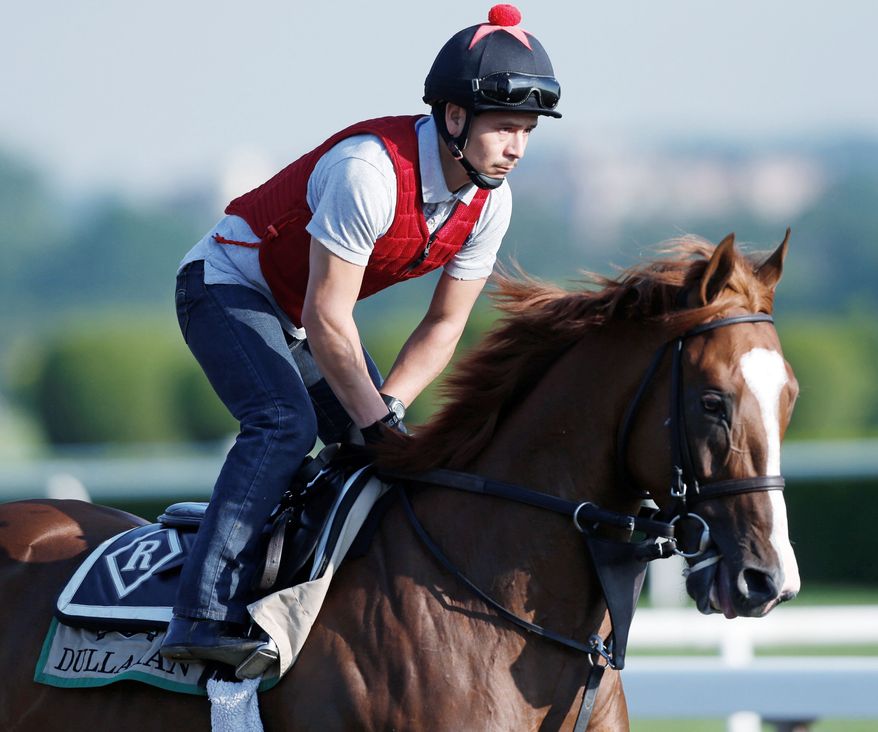 ASSOCIATED PRESS
Dullahan, with exercise rider Hector Herrarte up, is the best bet to knock off I'll Have Another in the Belmont Stakes and spoil the colt's bid for Triple Crown history.