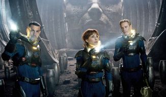 Logan Marshall-Green (left) and Noomi Rapace are scientists tracking humanity&#39;s origins, a search that takes them to another galaxy, and Michael Fassbender (right) is an android in &quot;Prometheus.&quot; (20th Century Fox via Associated Press)