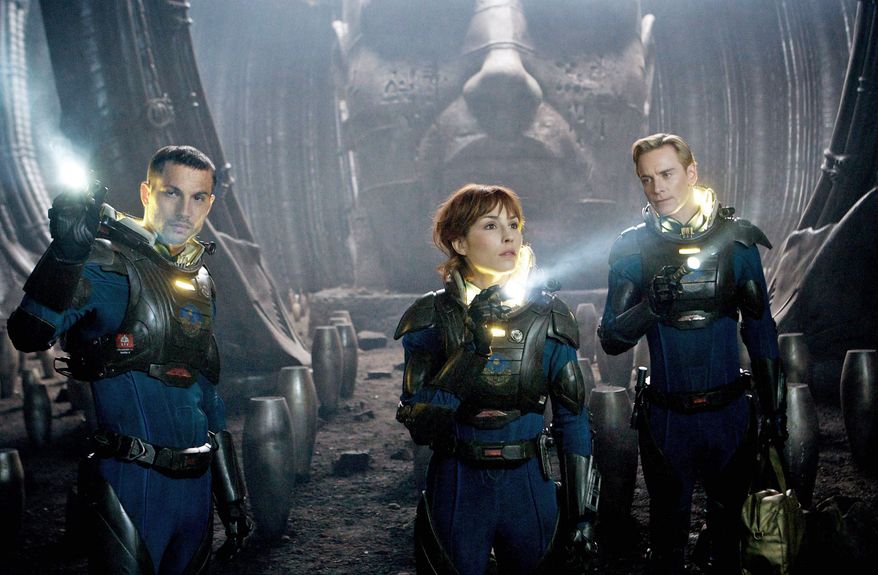Logan Marshall-Green (left) and Noomi Rapace are scientists tracking humanity's origins, a search that takes them to another galaxy, and Michael Fassbender (right) is an android in "Prometheus." (20th Century Fox via Associated Press)
