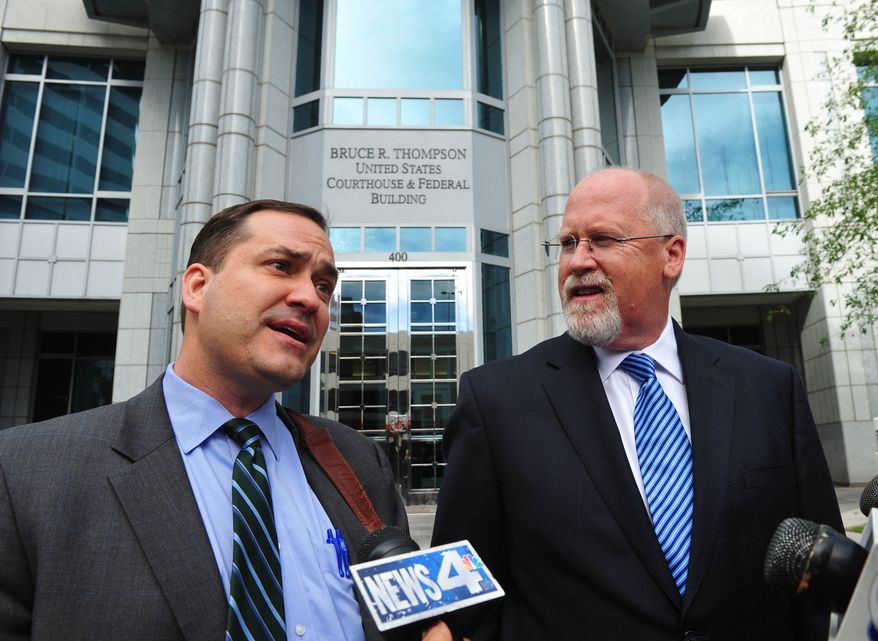 Defense attorney John Arrascada, left, with Harvey Whittemore at his side speak to the media after Whittemore's arraignment Thursday June 7, 2012 in Reno, Nev. Whittemore, a former developer and lobbyist with ties to Senate Majority Leader Harry Reid and Nevada's political elite pleaded not guilty to federal charges involving campaign contributions. (AP Photo/The Reno Gazette-Journal, Tim Dunn)