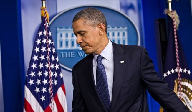 President Obama leaves after talking about the economy on Friday, June 8, 2012, in the briefing room of the White House in Washington. (AP Photo/J. Scott Applewhite)