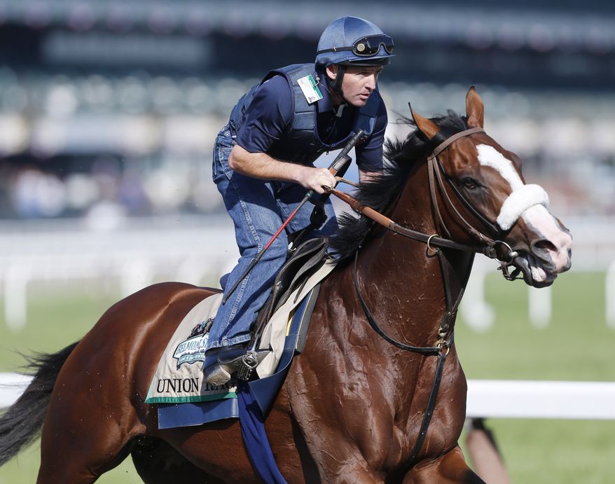 Bemont Stakes winner Union Rags, with exercise rider Peter Brette up, trains at Belmont Park in Elmont, N.Y., on Friday, June 8, 2012. (AP Photo/Mike Groll)