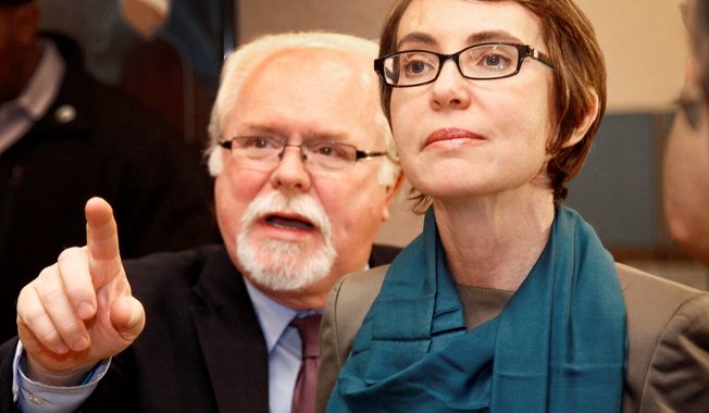 Ron Barber, seen here in January with then-Rep Gabrielle Giffords, Arizona Democrat, hopes to keep the seat that his former boss relinquished in the Democratic column in a special election on Tuesday. It is one of three House seats currently vacant. (Associated Press)
