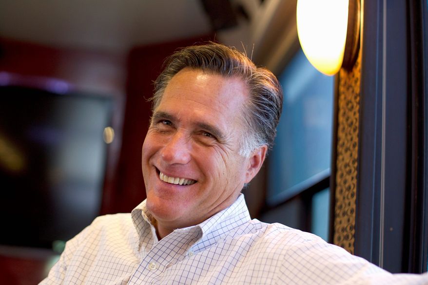 On the campaign trail, presumed Republican presidential nominee Mitt Romney tells voters to look at his record as governor in Massachusetts, where he balanced the budget every year. (Associated Press)