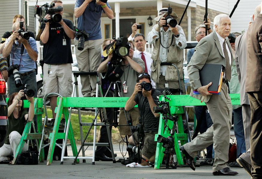 Former Penn State University assistant football coach Jerry Sandusky arrives Monday at the courthouse in Bellefonte, Pa., for opening statements in his trial on 52 counts of child sexual abuse. (Associated Press)