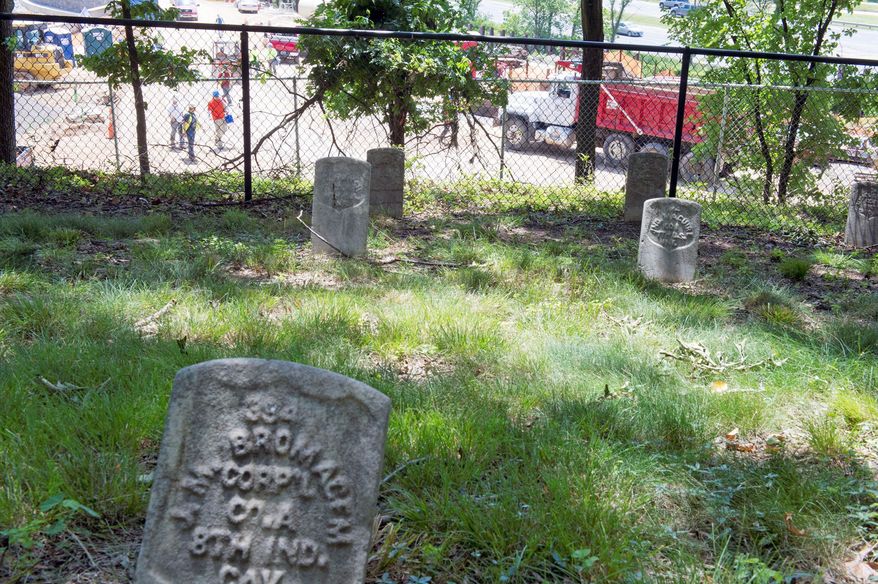 This Civil War graveyard on the grounds of the West Campus of the former St. Elizabeths Hospital overlooks the construction site of what will become the new Coast Guard headquarters. This entire campus is being rebuilt to house the Department of Homeland Security. The cemetery with its 300 graves will remain. (Barbara L. Salisbury/The Washington Times)