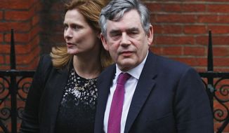 Former Prime Minister Gordon Brown arrives June 11, 2012, at the High Court in London with his wife, Sarah, to give evidence at Britain&#39;s inquiry into media ethics. (Associated Press)