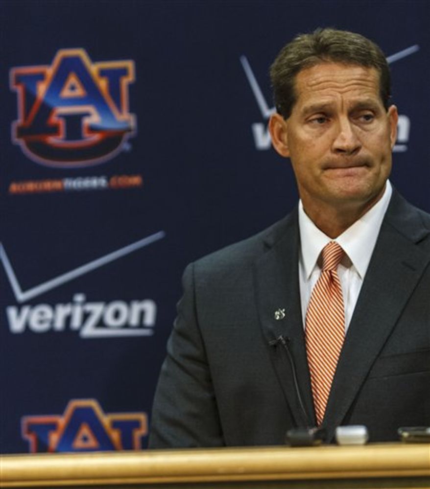 Auburn coach Gene Chizik talks about the shootings of college students including a couple of football players with the media on Tuesday, June 12, 2012, in Auburn, Ala. (AP Photo/Opelika-Auburn News, Vasha Hunt)
