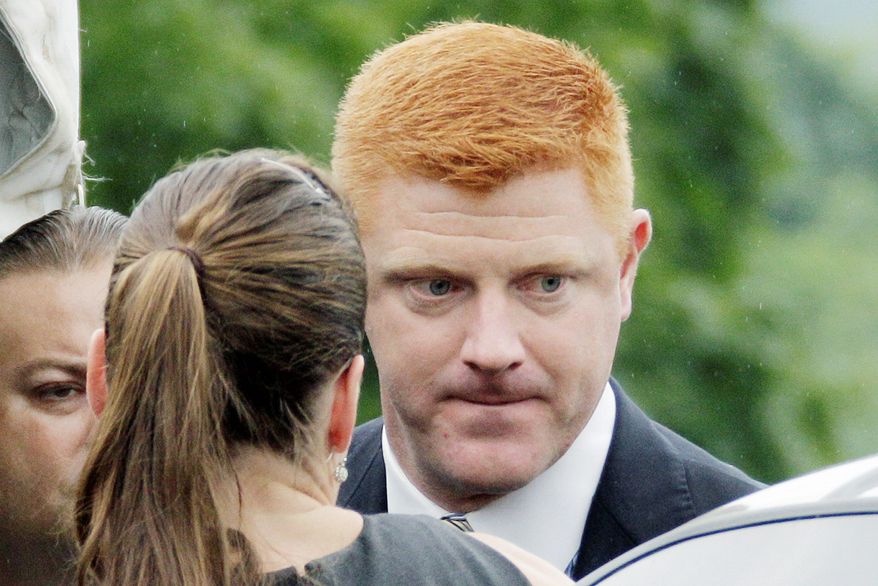 Mike McQueary testified Tuesday that he heard "skin-on-skin smacking sound" when he saw Jerry Sandusky and a young boy in an on-campus shower in 2001. (Associated Press)