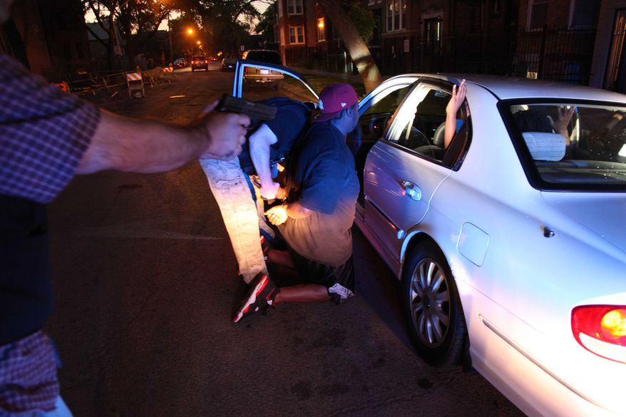 A high-speed pursuit of four suspected gang members on Chicago's West side ended with the Chicago Police gang unit questioning and arresting one of them on an outstanding warrant on June 9, 2012. (Associated Press)