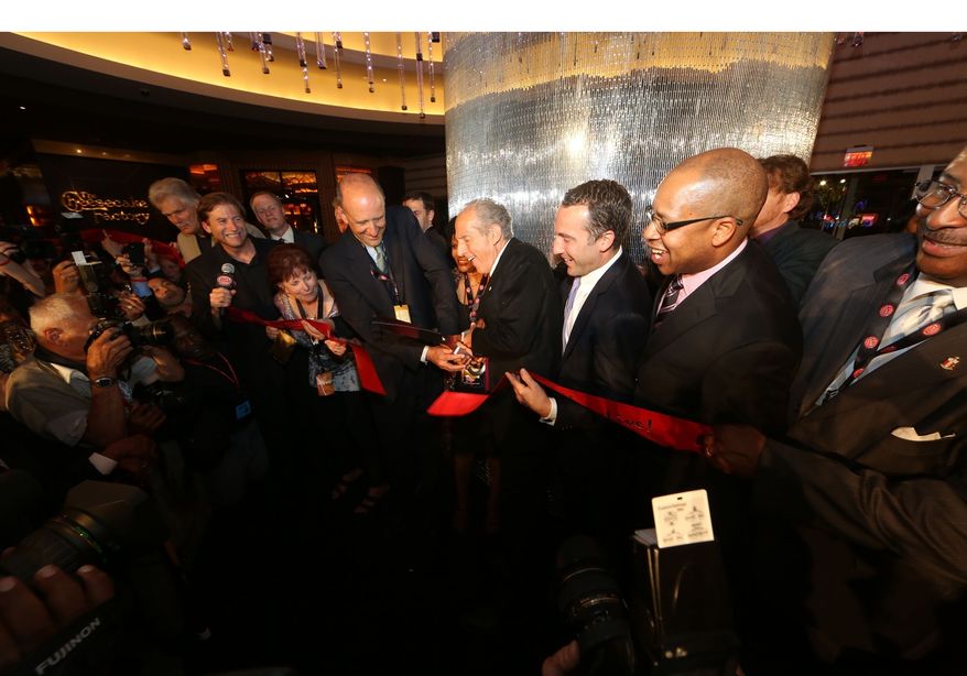 David Cordish (center), Chairmen of The Cordish Companies, and Anne Arundel County Executive John Leopold cut the traditional ceremonial ribbon to open the new $500 million Maryland Live! Casino at Arundel Mills, in Hanover, MD, on June 6, 2012. The new casino will feature 4,750 slot machines and electronic table games, making it the largest facility in Maryland and one of the largest casino properties in the gaming industry. (PRNewsFoto/Maryland Live! Casino)